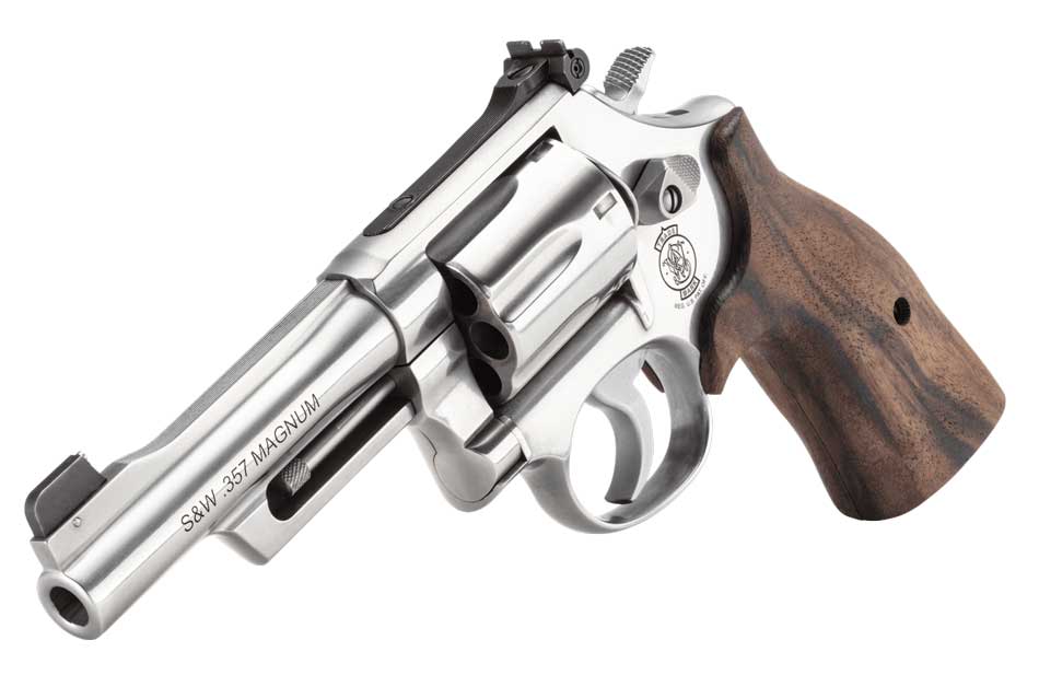 At the 2025 SHOT Show, I observed the Lipsey’s Exclusive Smith & Wesson Model 632-UC Ti in both black and silver finishes displayed at the Smith & Wesson booth. The titanium cylinder and aluminum alloy frame highlighted the revolver’s lightweight construction, and the 1.88-inch barrel design was paired with a bright dot tritium front sight and a black u-notch rear sight for defensive precision. The textured synthetic grips offered a secure hold, ensuring reliable control. A demonstration of its chamfered charge holes underscored its ease of loading. The booth’s attendees appreciated the revolver’s compact size and enhanced durability.