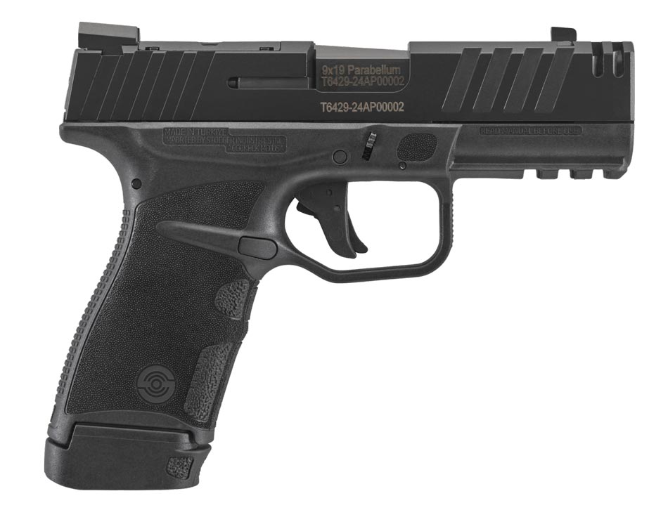 At the 2025 SHOT Show, I photographed the Stoeger STR-9 Thinline displayed at the Stoeger booth. The image highlights its ultra-slim, one-inch-wide frame and slide, emphasizing its compact design ideal for concealed carry. The extended grip with enhanced stippling patches is clearly visible, showcasing the pistol's ergonomic advantage for larger hands. The tritium sights are shown, reflecting the pistol’s readiness for low-light scenarios. Nearby informational signage details the STR-9 Thinline’s 14- and 16-round magazine capacities, drawing attention from show attendees. Bright lighting and polished surfaces accentuate the pistol's sleek appearance, underlining its modern aesthetic. This photo captures the balance of form and function that defines the STR-9 Thinline.